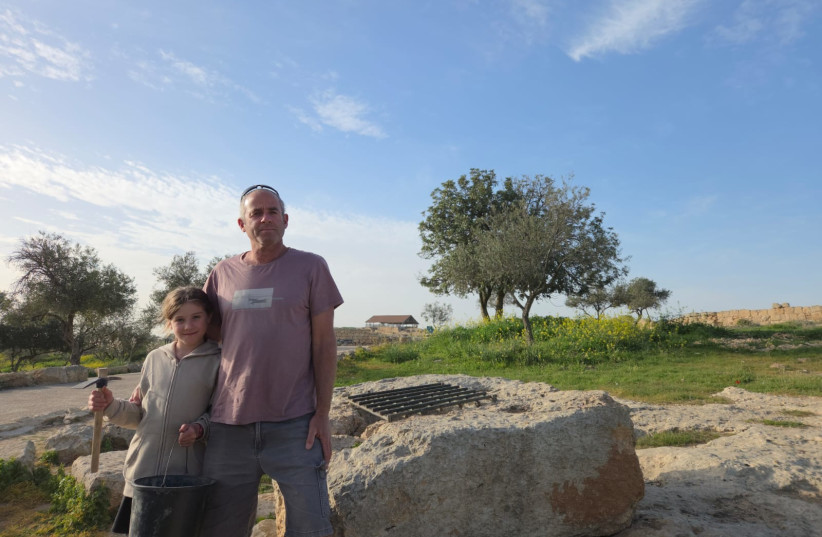 Nachshon and his daughter, Neta, after finding a bronze scale pan in the ancient Jewish settlement in Sussiya, February 19, 2026.
