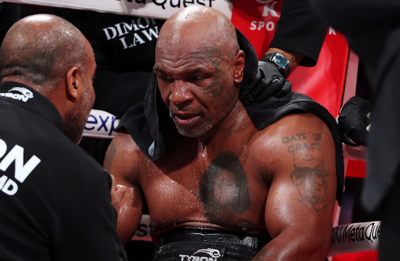Mike Tyson fights during LIVE On Netflix: Jake Paul vs. Mike Tyson at AT&T Stadium on November 15, 2024 in Arlington, Texas.