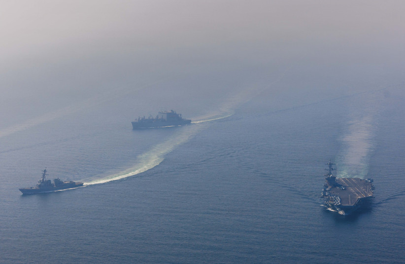 useThe USS Abraham Lincoln Carrier Strike Group sails in formation in the Arabian Sea, Feb. 6, 2026.