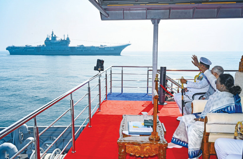 INDIA’S PRESIDENT Droupadi Murmu reviews ‘INS Vikrant’ from the review stand during the International Fleet Review 2026 in the Bay of Bengal, hosted by the Indian Navy off Visakhapatnam.