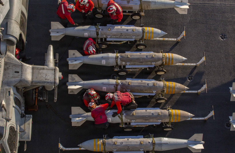 US Sailors prepare to stage ordnance on the flight deck of Nimitz-class aircraft carrier USS Abraham Lincoln (CVN 72) in support of Operation Epic Fury, Feb. 28, 2026.