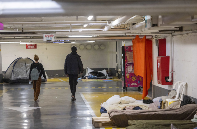 Israelis take shelter in an underground parking lot in Tel Aviv during the war with Iran and Lebanon as missiles are fired toward Israel, March 6, 2026.