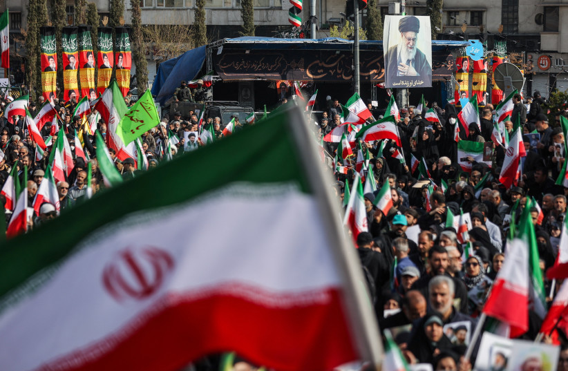 An image of late Iranian Supreme Leader Ayatollah Ali Khamenei is displayed on a pole during a gathering to support Iran's new supreme leader Mojtaba Khamenei, amid the U.S.-Israeli conflict with Iran, in Tehran, Iran, March 9, 2026. (credit: MAJID ASGARIPOUR/WANA