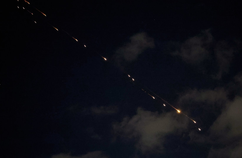 Rocket trails are seen in the sky above the Israeli center coastal city of Netanya amid a fresh barrage of Iranian missile attacks on March 9, 2026.