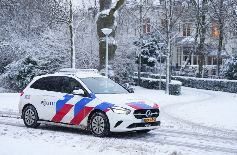A police car drives through Vondelpark in the city center following heavy snow to the region on January 07, 2026 in Amsterdam, Netherlands.