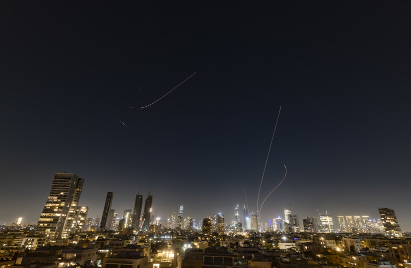 Anti-missile batteries fire interception missiles toward incoming ballistic missiles launched from Iran, as seen over Tel Aviv, during the war with Iran and ongoing missile fire toward Israel, March 16, 2026.