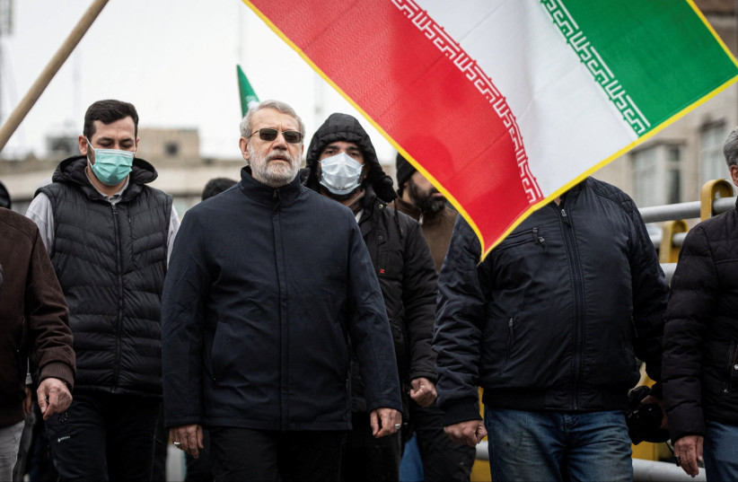 Iranian security chief Ali Larijani takes part in a pro-government rally in Tehran, Iran, March 13, 2026