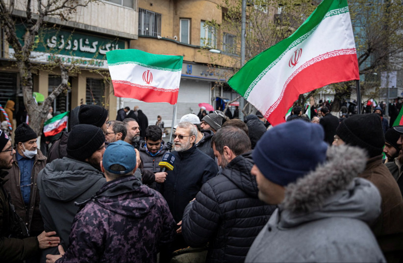 Iranian security chief Ali Larijani takes part in a pro-government rally in Tehran, Iran, March 13, 2026