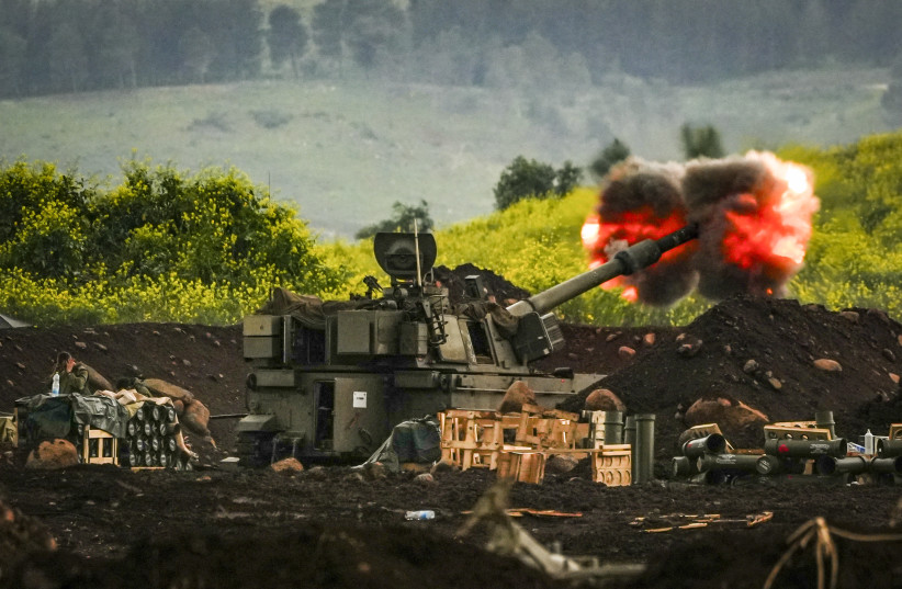 An artillery unit stationed near the Israeli-Lebanese border fires amid the ongoing war with Iran and Hezbollah, March 15, 2026