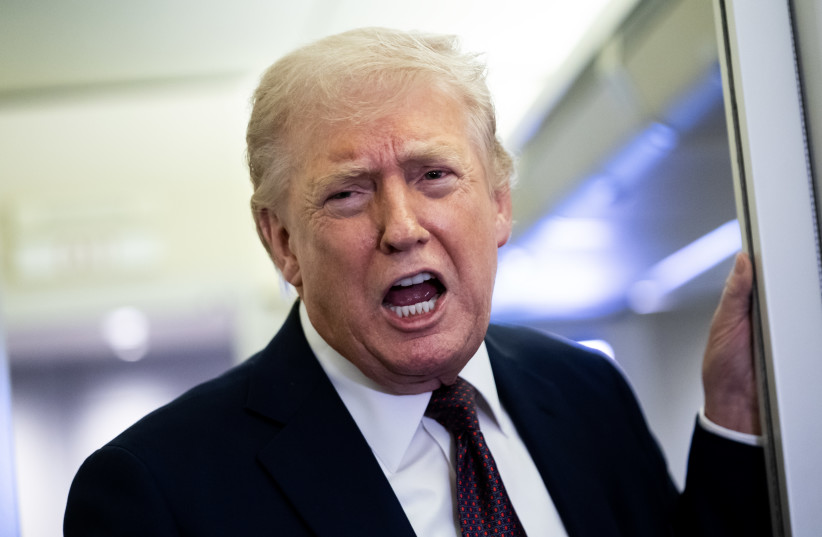 US President Donald Trump speaks to members of the media onboard Air Force One on March 15, 2026 while en route to Joint Base Andrews, Maryland from West Palm Beach Florida.