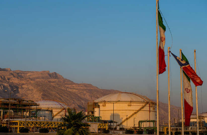 Iranian national flags fly near chemical storage tanks at the Arya Sasol Polymer Co. petrochemical complex which produces ethylene and polyethylene in Asaluyeh, Iran, on Tuesday, July 9, 2019.