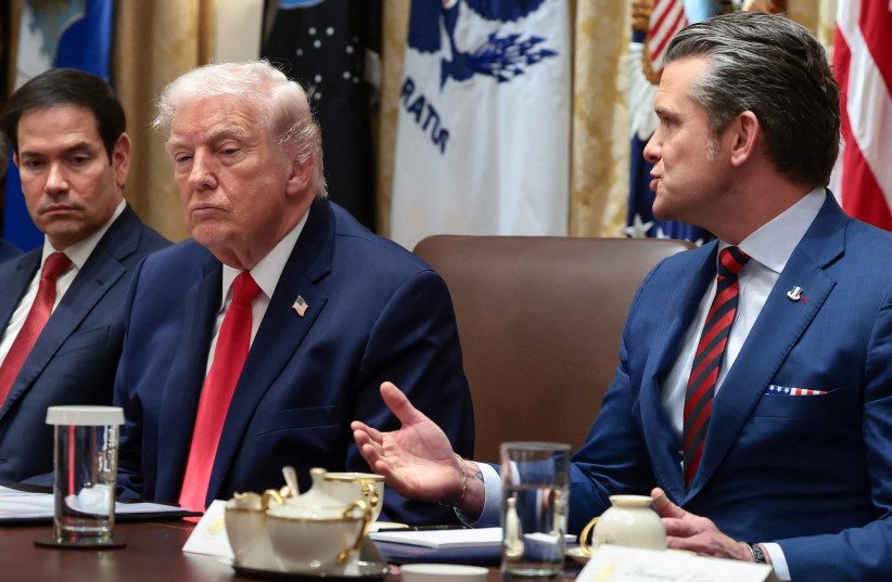 US Defense Secretary Pete Hegseth speaks next to President Donald Trump and Secretary of State Marco Rubio during a cabinet meeting at the White House in Washington, DC, US, January 29, 2026.