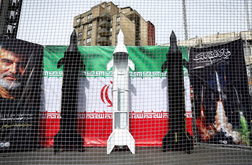 Symbolic mock-ups of Iranian missiles are displayed on a street, amid the U.S.-Israeli conflict with Iran, in Tehran, Iran, March 22, 2026. (credit: MAJID ASGARIPOUR/WANA