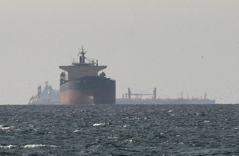 Cargo ships in the Gulf, near the Strait of Hormuz, as seen from northern Ras al-Khaimah, near the border with Oman’s Musandam governance, amid the US-Israeli conflict with Iran, in United Arab Emirates, March 11, 2026.