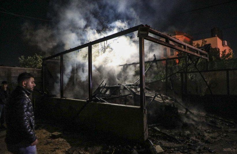 Palestinians stand at the scene where vehicles and homes were set on fire following an attack by extremist Jewish settlers on the village of Deir al-Hatab, east of Nablus in the West Bank, March 22, 2026.