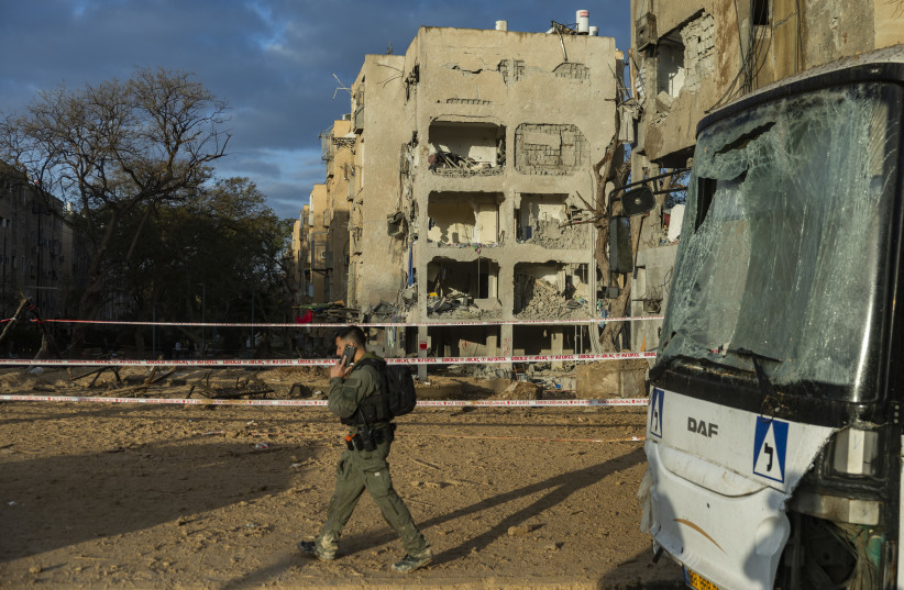 Israeli security and rescue forces at the scene where a missile fired from Iran toward Israel caused damage to residential buildings in the southern Israeli city of Arad, March 22, 2026.