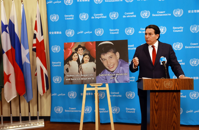 Standing beside a photo of victims of recent fighting, Israeli Ambassador to the United Nations (U.N.) Danny Danon speaks to reporters about the current situation in Iran at the U.N. on March 02, 2026, in New York City.