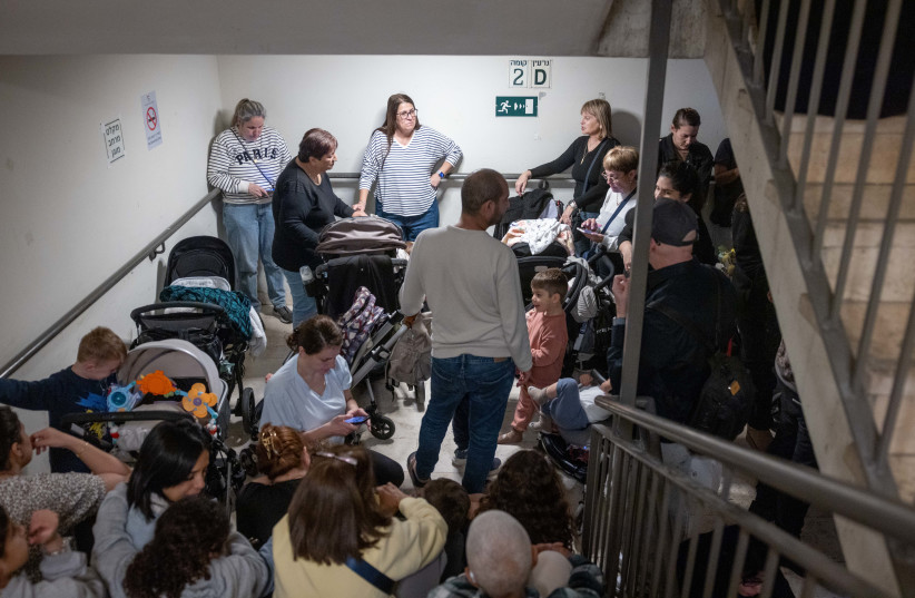 Israelis take cover at a public shelter as a siren warnd of incoming missiles fired from Iran, in Israel, March 31, 2026