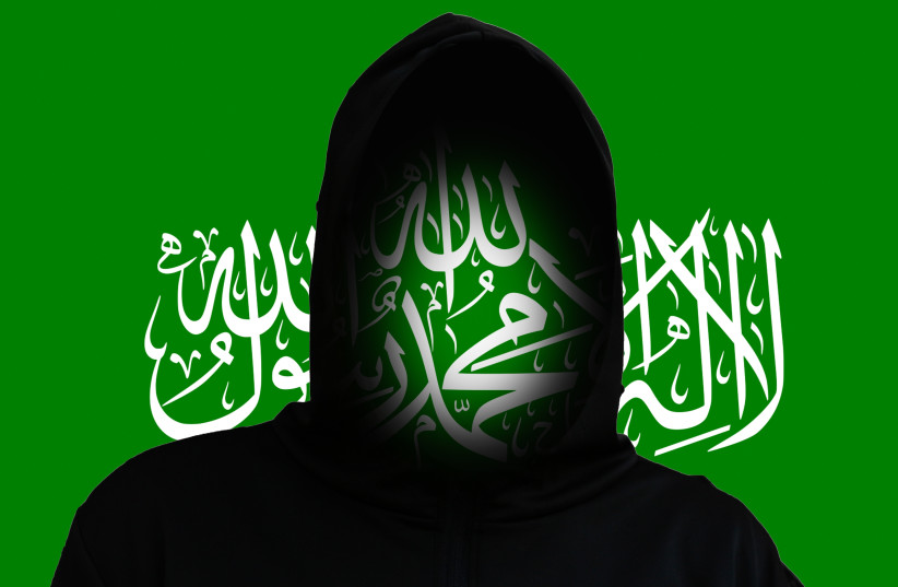 An illustrative image of a silhouette over the backdrop of the Hamas flag.