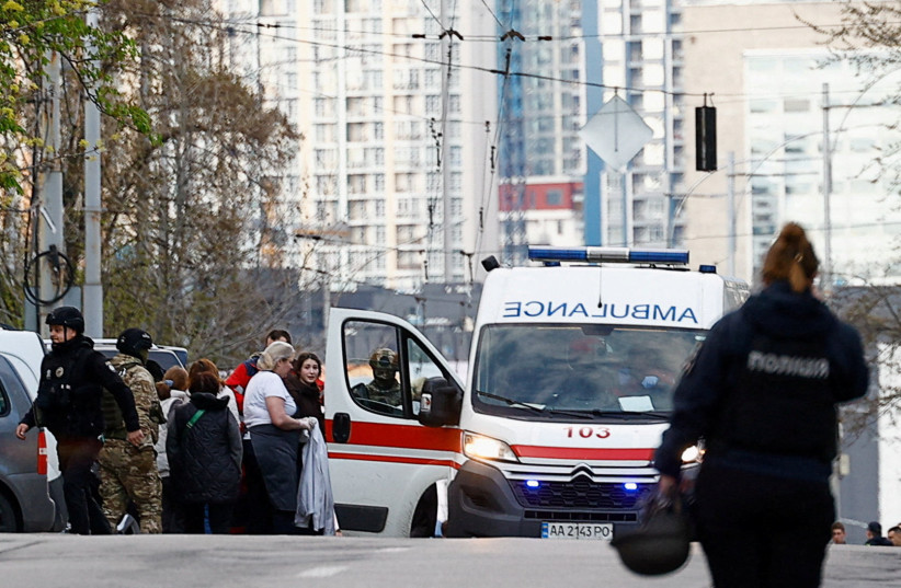 An ambulance at the site of a shooting incident, in Kyiv, Ukraine, April 18, 2026.