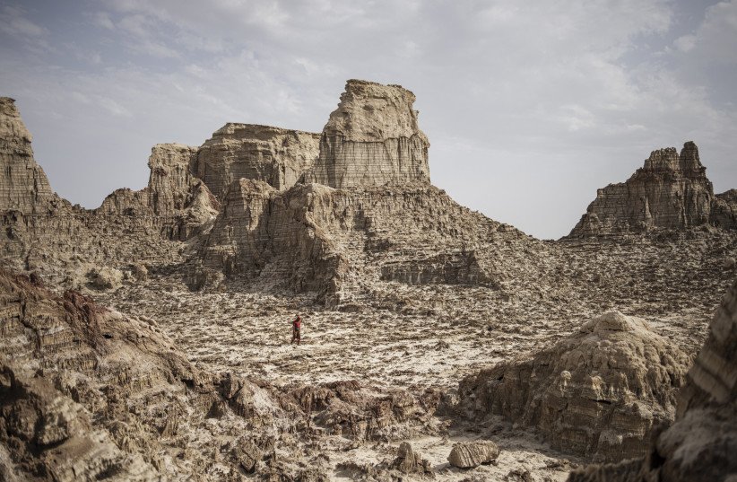 File Photo: A man walks through a salt canyon, near Dallol, in the Danakil Depression of the Afar region, on March 24, 2024.