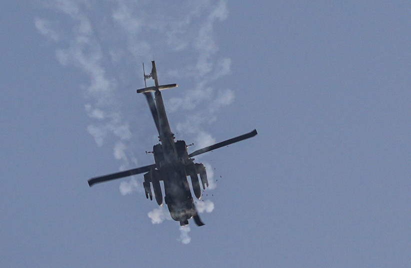 An Israeli military helicopter flies near the Israeli border with Lebanon, on April 16, 2026.