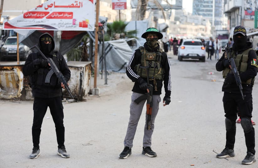 Terrorists from Hamas and Palestinian Islamic Jihad stand on a street during Eid al-Fitr in Gaza City, March 20, 2026.
