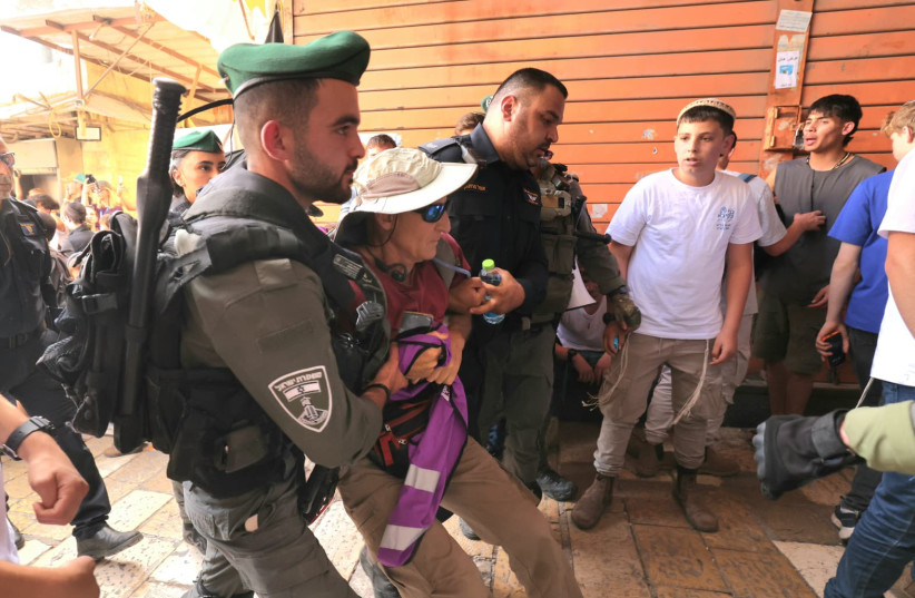 AN ACTIVIST being escorted out of the Old City ahead of the Jerusalem Day flag march, May 14, 2026.