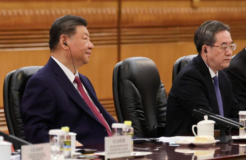Chinese President Xi Jinping, alongside Chinese Vice Premier Ding Xuexiang, attends a bilateral meeting with Russian President Vladimir Putin (not pictured) at the Great Hall of the People in Beijing, China May 20, 2026.