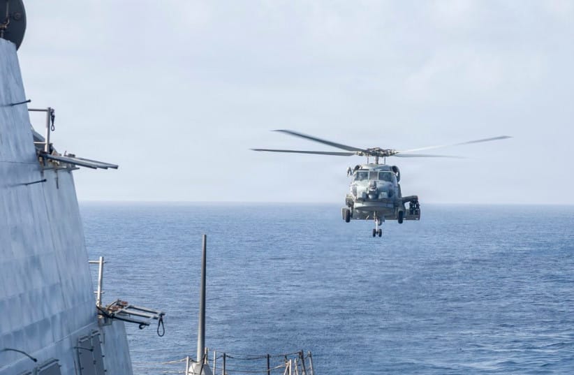 An MH-60R Sea Hawk helicopter approaches USS Delbert D. Black (DDG 119) after patrolling the Arabian Sea in support of the US blockade against Iran, May 27, 2026.