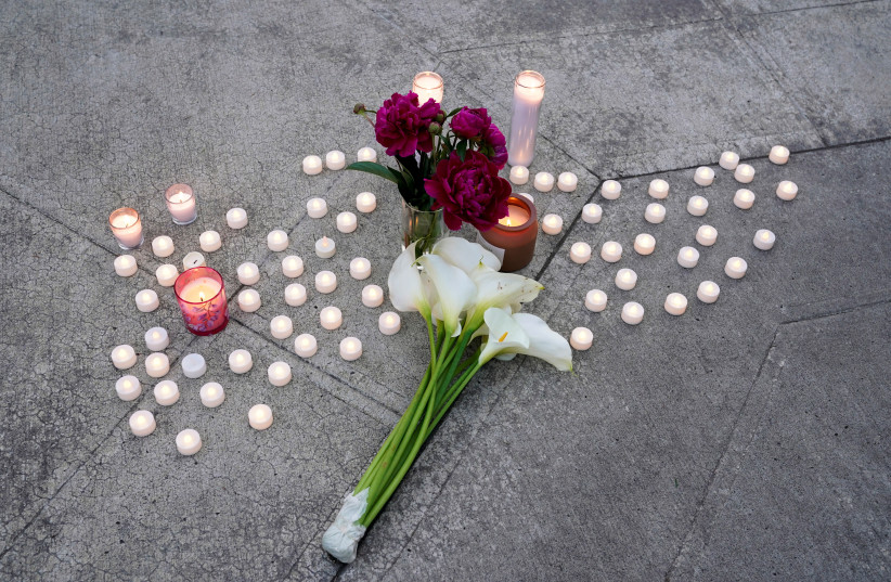 Candles and flowers placed during a vigil after a chemical tank rupture at the Nippon Dynawave Packaging pulp and paper mill, in Longview, Washington, US, May 26, 2026.