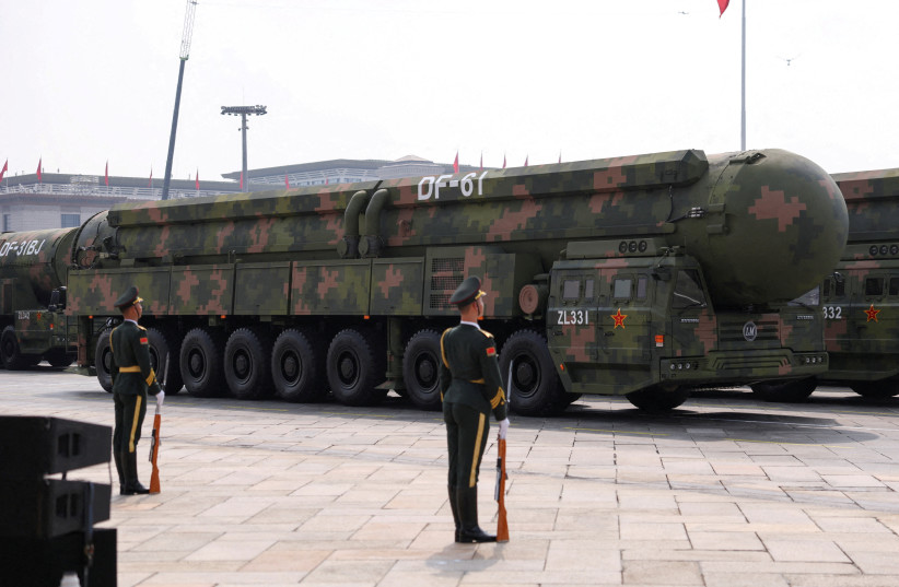 Members of the People's Liberation Army stand as the strategic strike group displays DF-61 nuclear missiles during a military parade in Beijing, China, September 3, 2025.