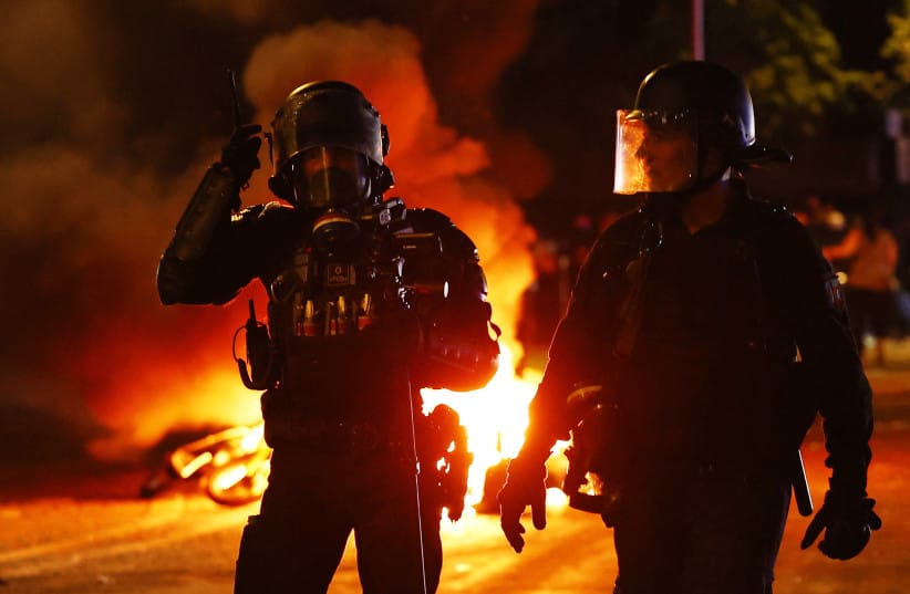 Police officers in the streets after Paris St Germain won the UEFA Champions League.