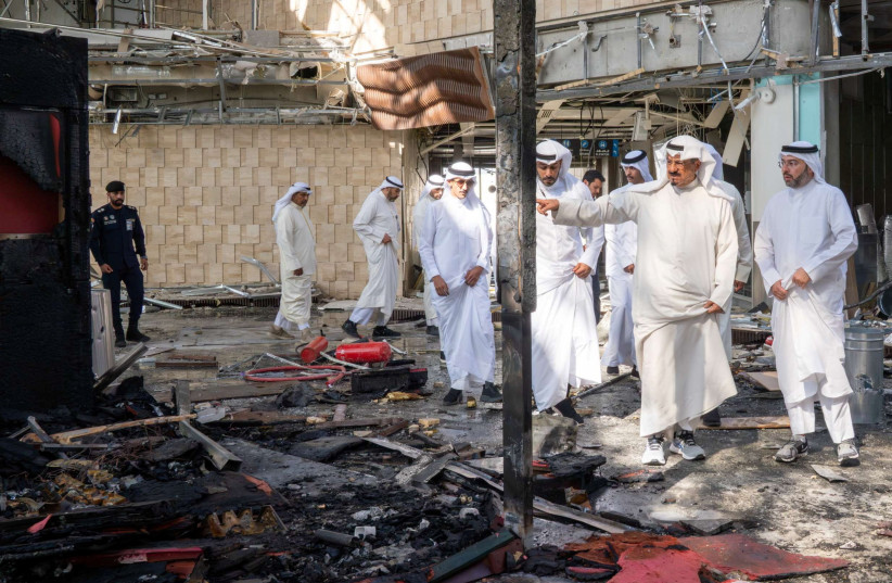 Kuwaiti officials inspect damage inside a terminal at Kuwait International Airport following a drone and missile attack, in Kuwait City, Kuwait, June 3, 2026.