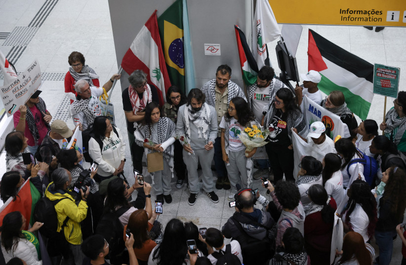 Ariadne Telez, Cassio Pelegrini, and Beatriz Moreira, Brazilian activists who were detained aboard the Gaza-bound Global Sumud Flotilla, which was intercepted by Israeli forces, in Guarulhos, Brazil, May 24, 2026.
