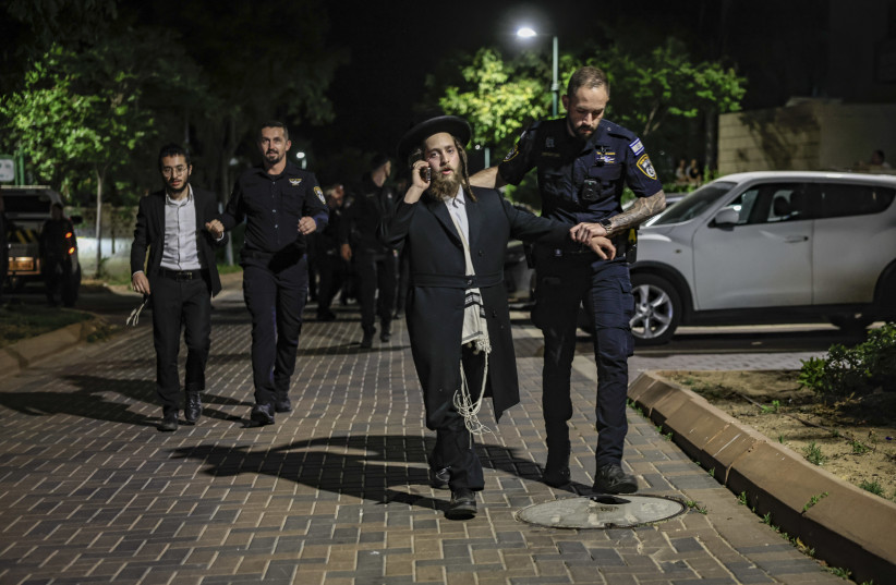 Ultra-Orthodox Jewish men protest outside the home of Military Police commander Brig.-Gen. Yuval Yamin, in Ashkelon, April 28, 2026