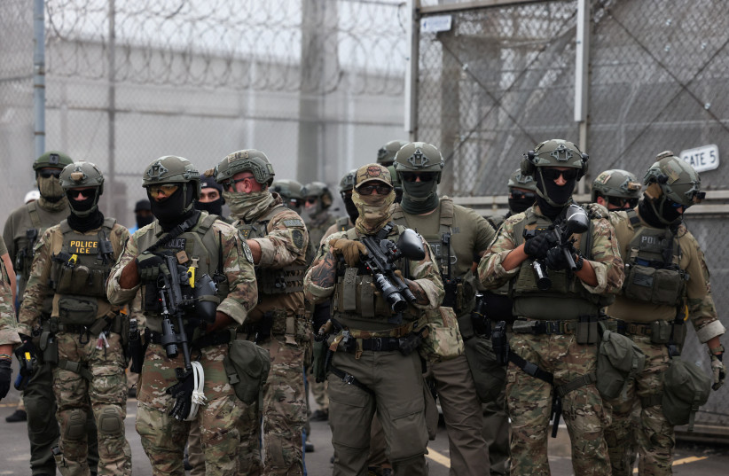 Federal law enforcement clears an entry point for vehicles to Delaney Hall during ongoing protests against U.S. Immigration and Customs Enforcement (ICE) outside the Delaney Hall detention center, in Newark, New Jersey, US, June 6, 2026.