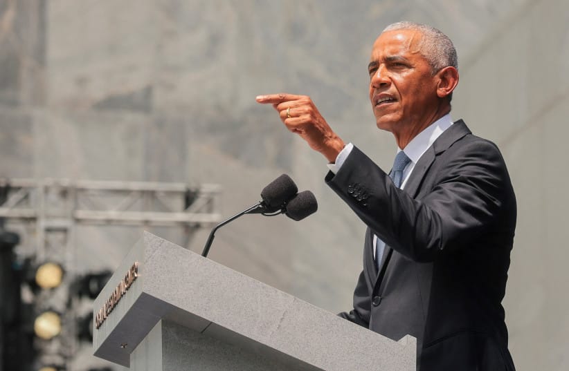 Former US president Barack Obama delivers his speech at the dedication ceremony for the opening of the Obama Presidential Centre in Chicago, Illinois, US, June 18, 2026. Picture taken through the bulletproof glass.