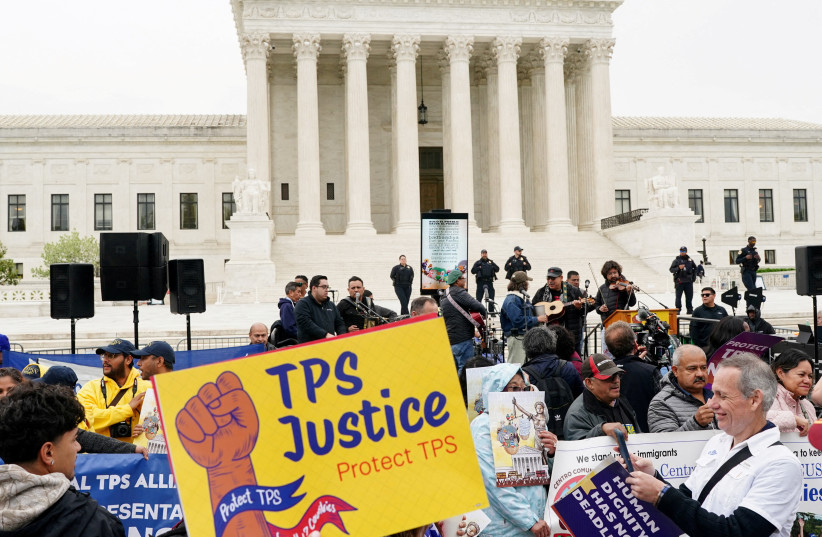 Immigrants' rights activists and demonstrators attend a rally outside the U.S. Supreme Court, as justices were scheduled to hear arguments on whether the administration of U.S. President Donald Trump can end the Temporary Protected Status (TPS) of Syrian and Haitian nationals, in Washington, D.C.,