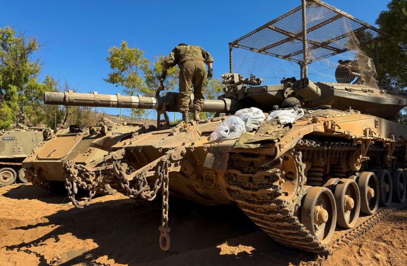 An Israeli soldier works on a tank on the Israeli side of the Israel-Lebanon border, after Israel and Lebanon signed a framework agreement following US-mediated talks, in northern Israel, June 28, 2026.