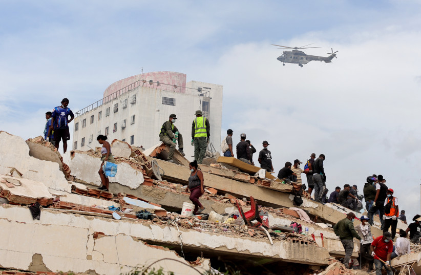 Rescuers search for victims at collapsed building on June 28, 2026 in Carabellada, La Guaira, Venezuela.