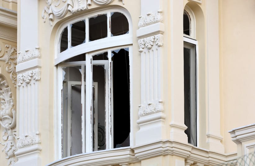 Shards of glass on a damaged window of a residential building, following an explosion on Monday, in Monaco, June 30, 2026.