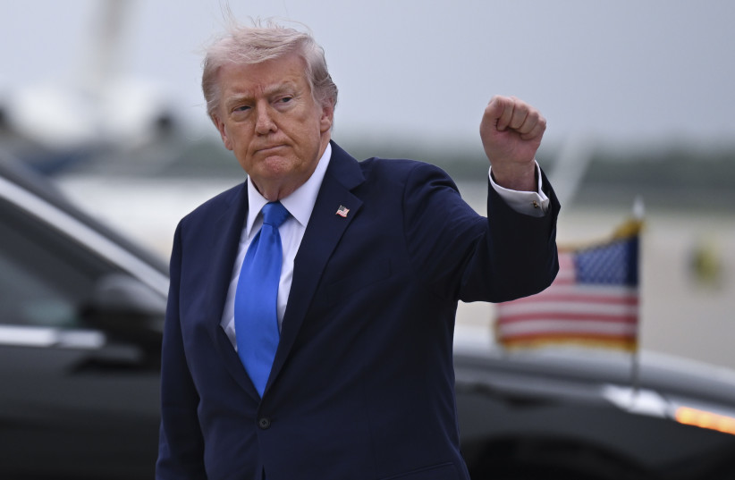 US President Donald Trump waves after landing at Joint Base Andrews as he returns to Washington on April 25, 2026 in Joint Base Andrews, Maryland. President Trump returned to Washington after hosting a cryptocurrency conference at his Mar-a-Lago estate in Palm Beach Florida.