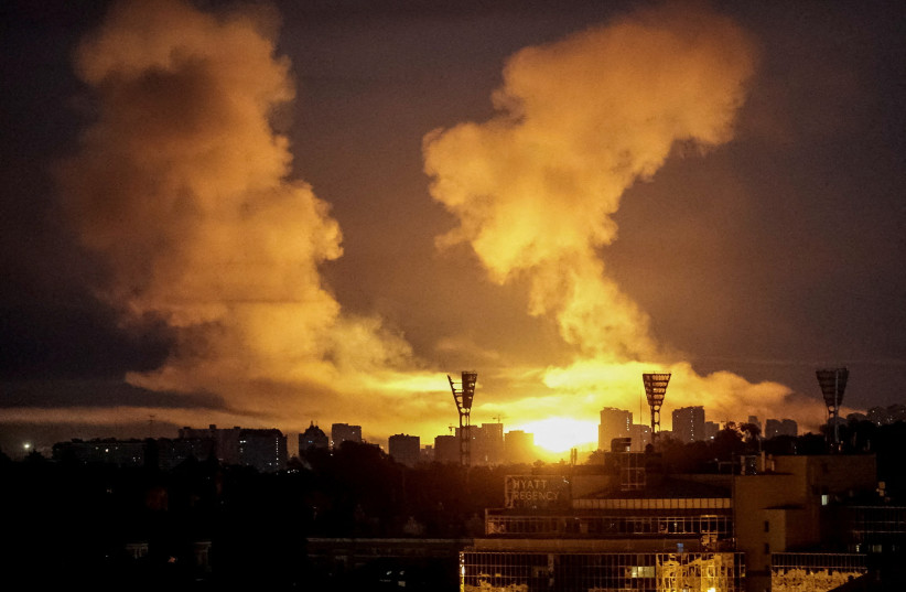 An explosion lights up the sky over the city during a Russian missile and drone strike, amid Russia's attack on Ukraine, in Kyiv, Ukraine July 2, 2026.