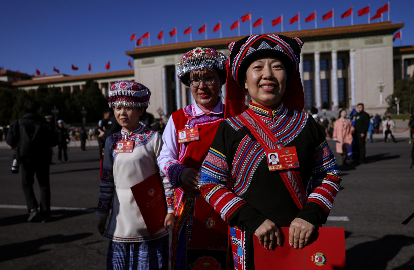Delegates in ethnic minority costumes leave the Great Hall of the People following the closing session of the Chinese People's Political Consultative Conference (CPPCC), in Beijing, China, March 11, 2026.