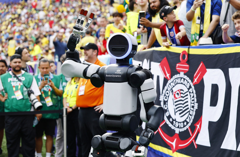 Hyundai robot Atlas brings the match ball out before the second half of the Brazil v Norway FIFA World Cup game, July 5, 2026.
