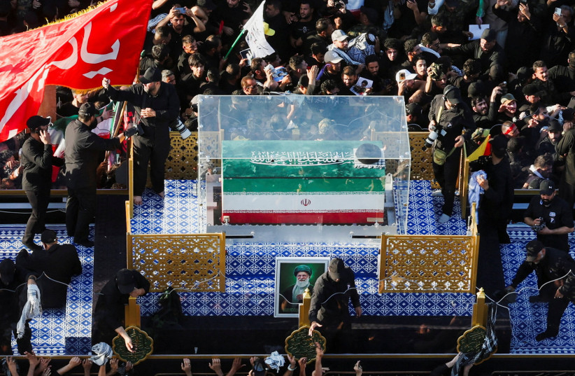 A vehicle carrying the coffin of Iran's slain Supreme Leader Ayatollah Ali Khamenei makes its way as people attend Khamenei's funeral procession, in Najaf, Iraq, July 8, 2026