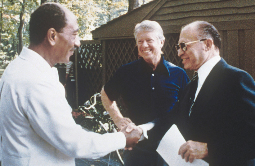 MENACHEM BEGIN, Jimmy Carter, and Anwar Sadat at Camp David, 1978.