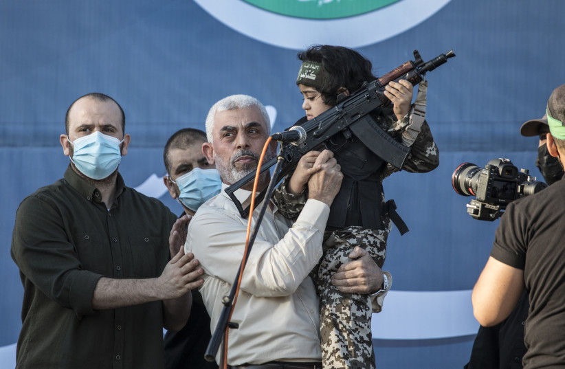 Yahya Sinwar, (C) the elected leader of Hamas appears during a ceremony for fighters killed by Israeli air strikes at Yarmouk football Stadium on May 24,2021 in Gaza City, Gaza.