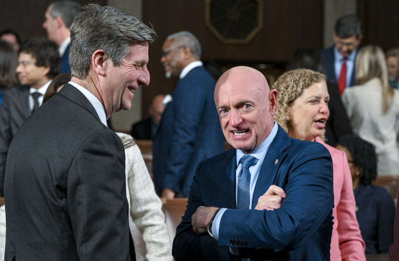 US Sen. Mark Kelly (D-AZ) (R) and Rep. Greg Stanton (D-AZ) talk about prior to President Donald Trump delivering the State of the Union address during a joint session of Congress at the Capitol on February 24, 2026 in Washington, DC.